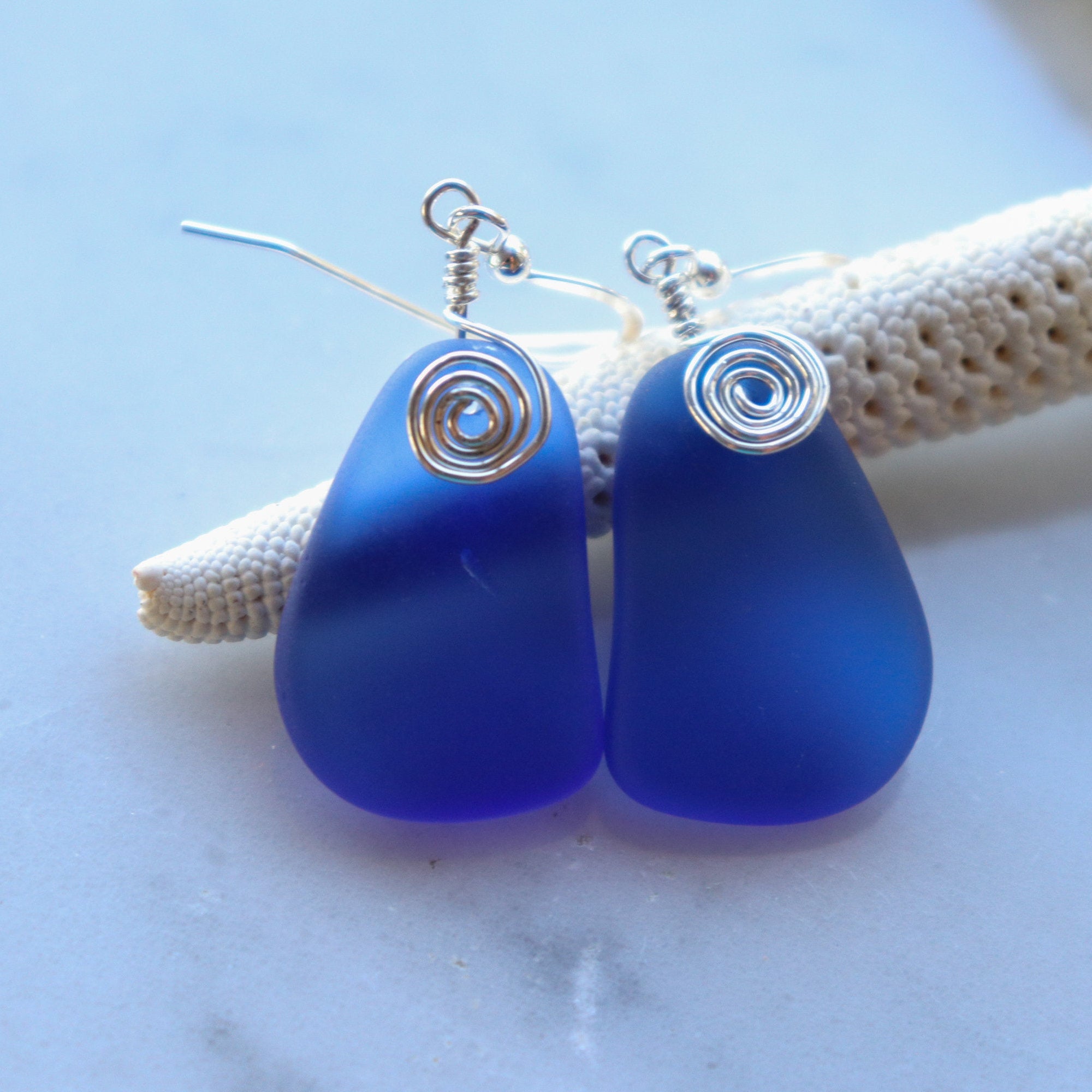 Deep blue frosted glass teardrop earrings in gold, minimalist ocean-inspired jewelry